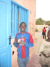 Promising talibe student Djibi, outside classroom