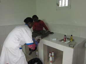 Nurse Anta treating a talibe patient in infirmary