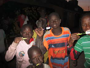 Talibes brushing their teeth for the first time