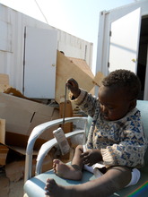 a DRC resident helping to unpack our clinic
