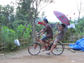 Rafael    teaching the kids to ride a bike