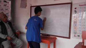 A deaf and mute kid  learning to write.