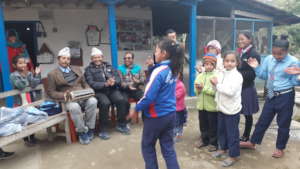 A kids  dancing to welcome  committee member