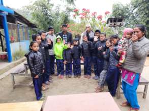 The kids  happy to receive and wear  jackets