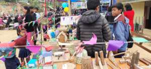 Kids demonstrating their  handicraft goods