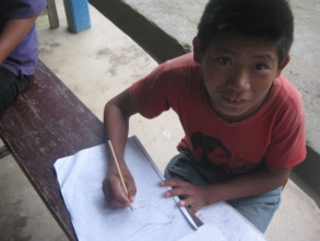 A deaf boy  drawing a cock