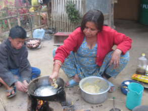 Care taker mother preparing food for  the kids