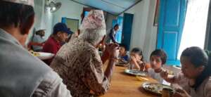 Kids having  feast  with the  committee