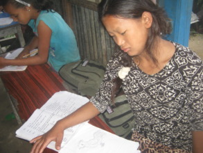 Deaf girls doing  their homework