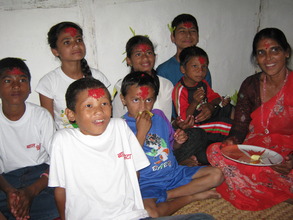 Kids receiving   Tika an d Jamara