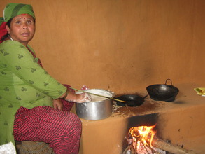 Cook Mother cooking Sel Roti for the kids
