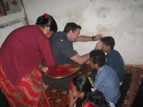 Michael providing Tika to the kids