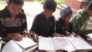 some boys doing homework