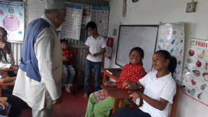 A teacher in the school classroom