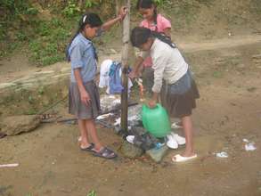 Children filling the water pot