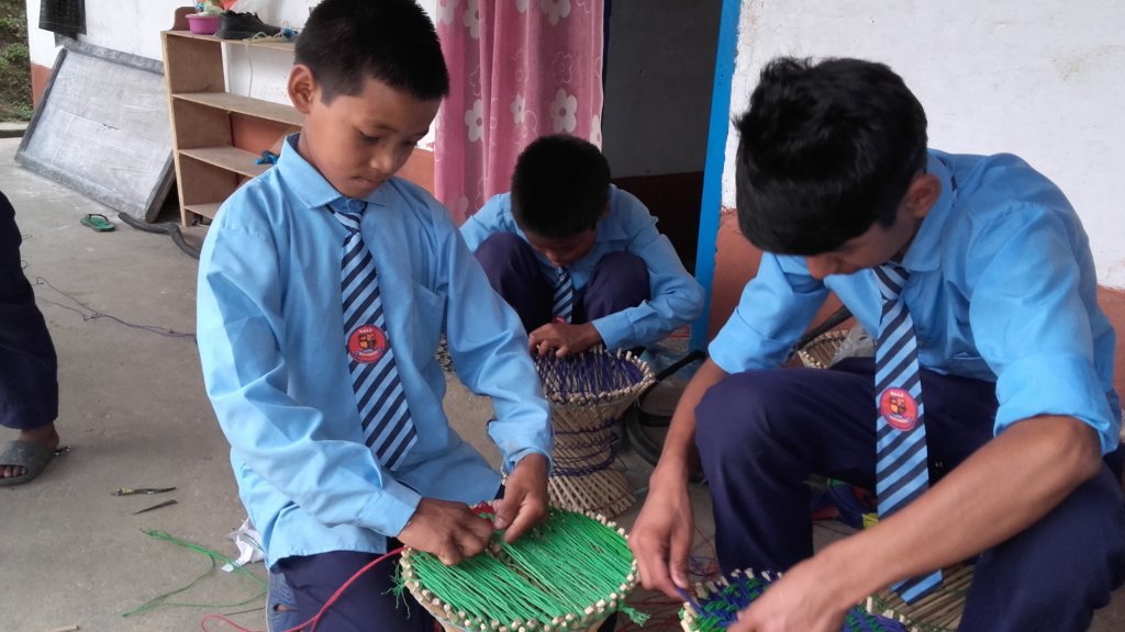 Provide materials to 15 deaf and mute Nepali kids.