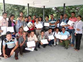 Teachers receive their training certificates.