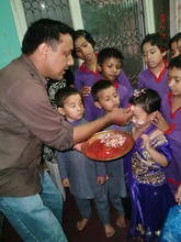 Project Leader with children....