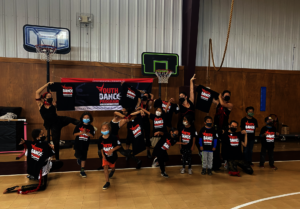Students with Dancing Earth dancers, Nambe Pueblo