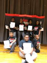 Students with their Certificates of Achievement