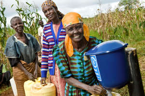 Community members using a dispenser Photo: Kalan