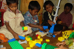 Children working with LEGO Duplo blocks