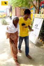 JAAGO Senior Student helping an Elderly