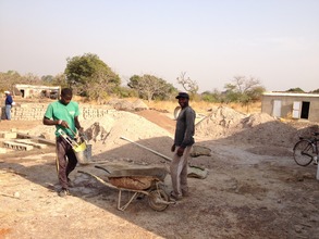 Kaly Camara and assistant working hard!