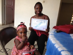 Anna (& daughter) with her pharmacy school diploma