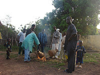Preparing drums for celebration at Djendji village
