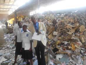Lead Us Today students with collected recyclables
