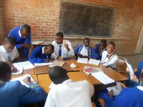 Students writing a proposal for their project