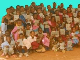 Children (OVC) receiving uniforms and books