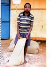 Young boy taking home food supply