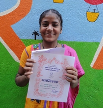 Suman and her certificate of achievement