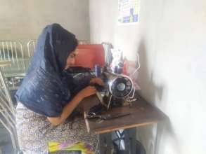 Think Tank member sewing a mask- 2
