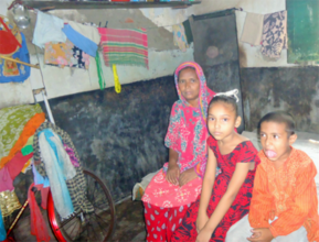 Zahid with his mother and sister at their home