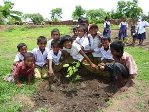 Students planting fruit trees with FTPF