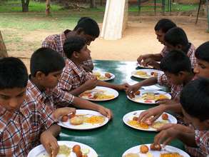 Children having food at the hostel