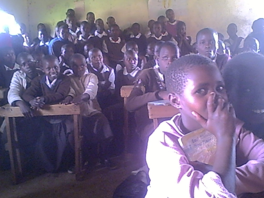 PUPILS PAY ATTENTION TO TRAINER IN A CLASSROOM