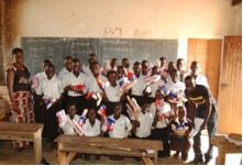 Pupils receiving packages of resuable pads