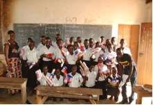 Pupils receiving packages of resuable pads