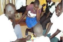 Youth relaxing as they play games