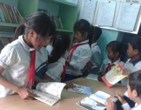 Tribal students enjoying their books