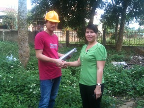 Architect and headmistress at construction site