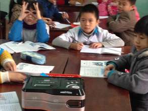 Students using cassette player in English class