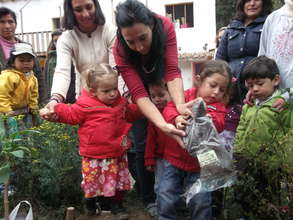 Kids helping to plant our tree