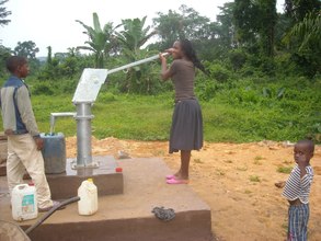 Girl pumping for water