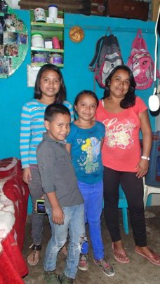 Jacqueline with her mom and younger siblings