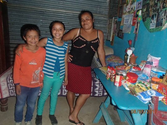 With her mom and her brother and food basket